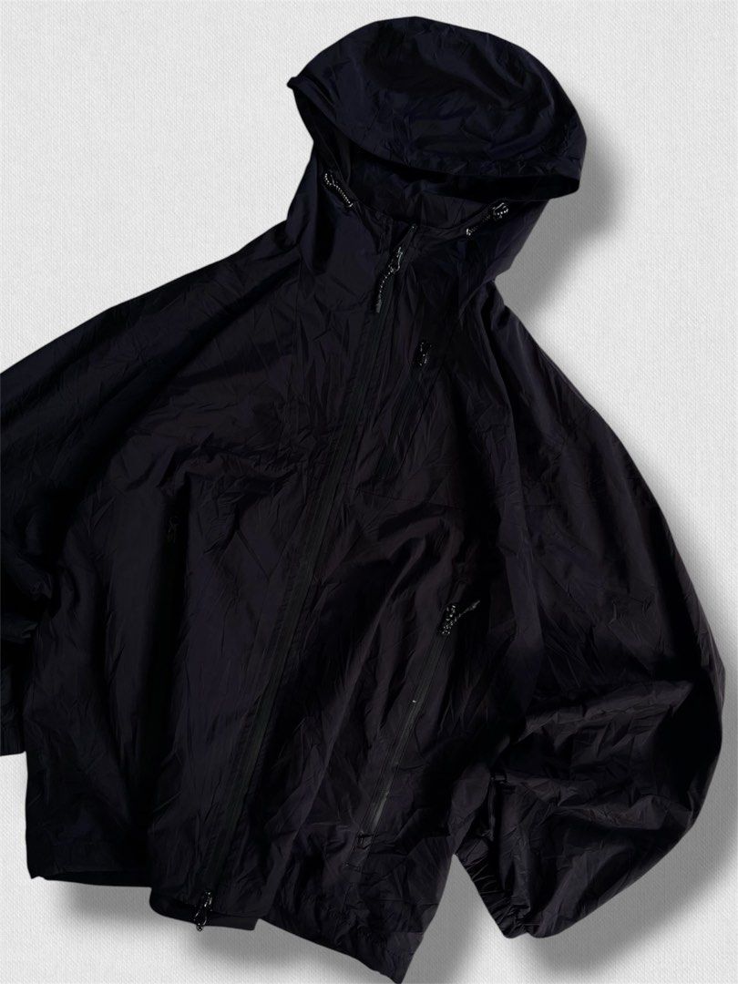 Black hooded windbreaker jacket with zip pockets (Category: Coats, Jackets and Outerwear) located in Cebu City. Submitted by northdrip.threadd (Listing ID 1467905056, Image 2). Description: - Color: Black - Style: Relaxed, slightly oversized hooded windbreaker - Material: Lightweight and comfortable - Closure: Full front zip with high collar and adjustable drawcords - Pockets: Dual zippered slanted front pockets - Cuffs & Hem: Elasticated for a s