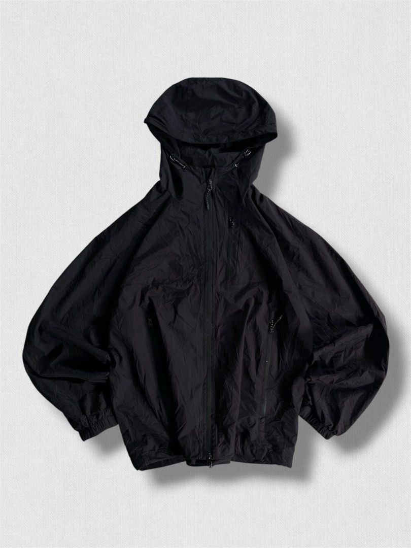 Black hooded windbreaker jacket with zip pockets (Category: Coats, Jackets and Outerwear) located in Cebu City. Submitted by northdrip.threadd (Listing ID 1467905056, Image 1). Description: - Color: Black - Style: Relaxed, slightly oversized hooded windbreaker - Material: Lightweight and comfortable - Closure: Full front zip with high collar and adjustable drawcords - Pockets: Dual zippered slanted front pockets - Cuffs & Hem: Elasticated for a s