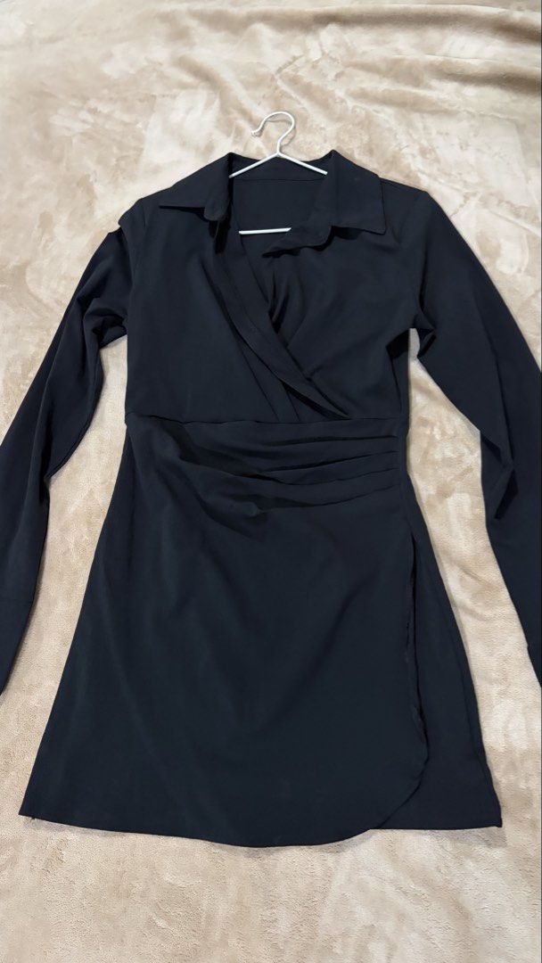 Black long sleeve collar wrap dress (Category: Dresses) located in Manila. Submitted by declutterwithesca (Listing ID 1468028823, Image 1). Description: - Color: Black - Style: Long sleeve wrap dress with collar and short hemline - Fit: Fitted silhouette with flattering ruched front waist detailing - Fabric: Smooth, comfortable material - Occasion: Ideal for going out or smart casual wear - Condition: Used once (graduation).