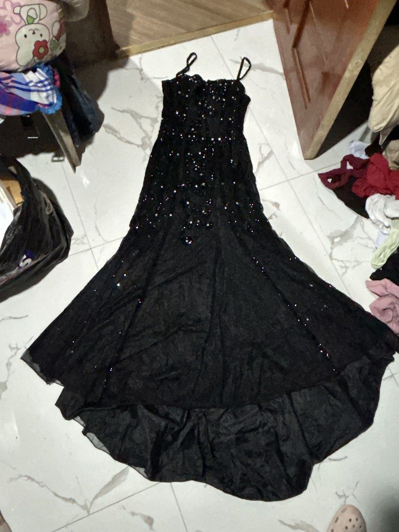 Black sequin formal evening dress high low hem spaghetti strap (Category: Evening dresses & gowns) located in Tuguegarao City. Submitted by eliwyxzs (Listing ID 1467853643, Image 1). Description: - Color: Black - Style: Formal evening dress with spaghetti straps and high-low hem - Details: Densely embellished with heavy sequins and beads in a swirl pattern on the bodice - Skirt: Flowing layers with scattered sequins along the sides - Closure: Bac