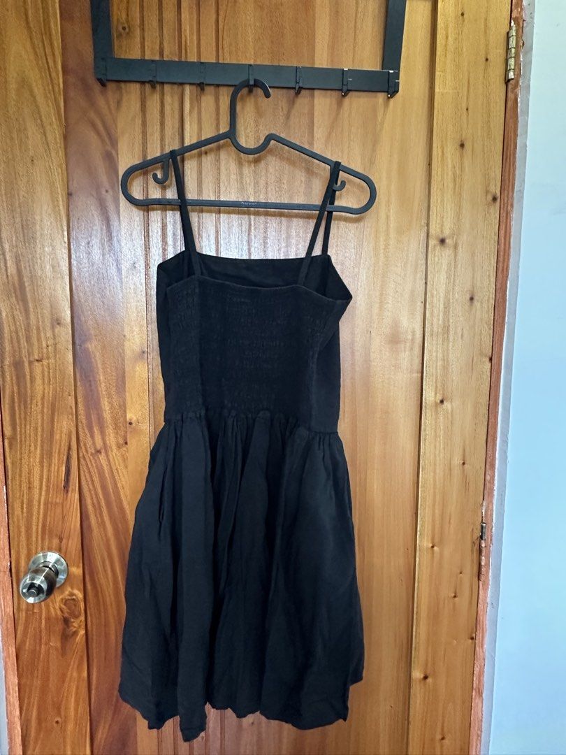 Black square neck spaghetti strap mini dress (Category: Dresses) located in Makati City. Submitted by shopwithbq (Listing ID 1467946076, Image 2). Description: - Style: Simple black mini dress - Design: Square neckline with thin spaghetti straps - Fit: Fitted bodice and a flared, gathered skirt - Comfort: Stretchy smocked back for an easy fit - Versatility: Great basic piece to dress up or down.