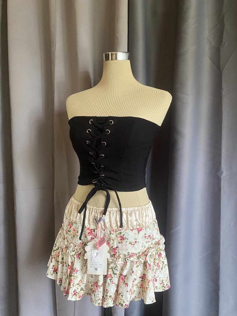 Black Strapless Front Lace Up Corset Top (Category: Sleeveless) located in Cagayan de Oro. Submitted by curated_closetph (Listing ID 1467940789, Image 2). Description: — Size : XS - S — Color: Black — Strapless bandeau silhouette — Front lace-up detail with silver metal eyelets — Structured boning for waist shaping — Straight hemline for versatile styling — Minimalist back design — Structured stretch fabric for a comfortable fit — Can negotiate t