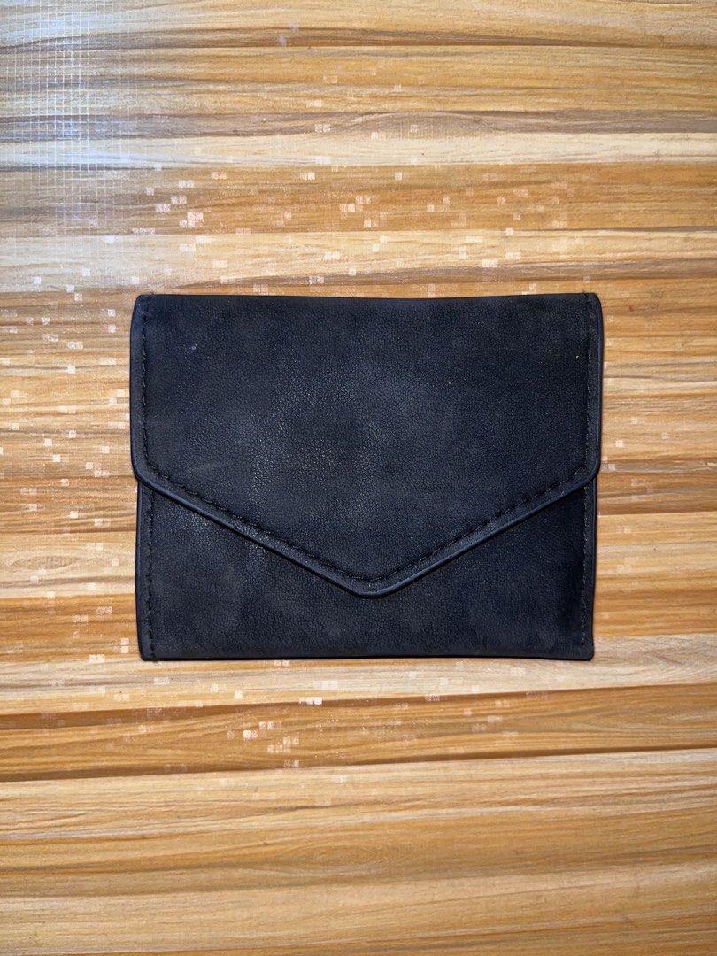 Black Tri-Fold Wallet with Card Slots and ID Window (Category: Wallets & Card holders) located in Naic. Submitted by nasaryn_ (Listing ID 1467977488, Image 1). Description: - Color: Black - Material: Textured faux leather - Closure: Snap closure flap - Features: ID window slot, multiple card slots, and full-length cash compartment - Condition: Clean interior and exterior, ready for daily carry.