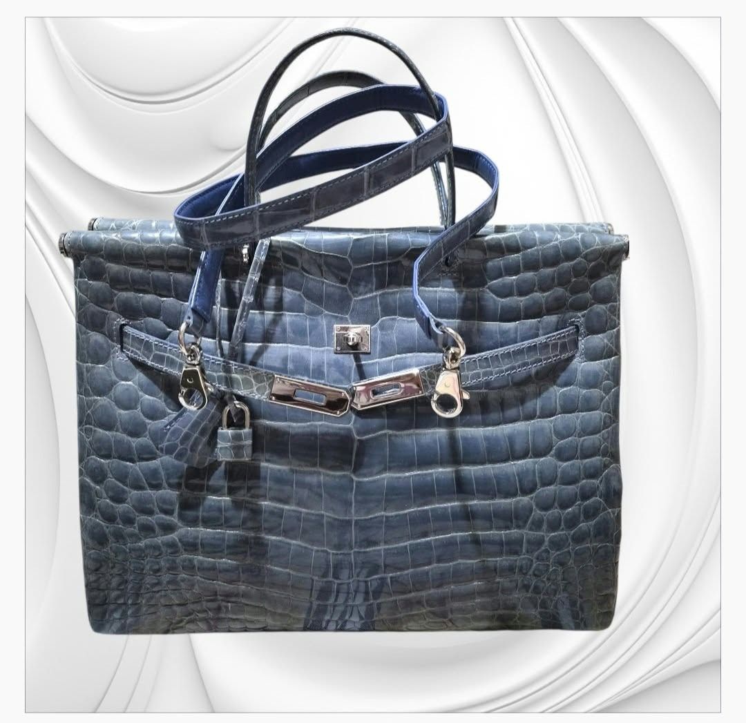 Blue Crocodile Embossed Leather Handbag With Strap And Lock (Category: Luxury Bags & Wallets) located in Paranaque City. Submitted by calm_youngstore7 (Listing ID 1468022902, Image 3). Description: A luxury blue crocodile leather handbag resembling an Hermès Birkin or Kelly 35 style in an exotic finish. • Material: Genuine or textured exotic leather featuring distinct scale patterns (such as Porosus or Niloticus crocodile/alligator). • Color: Dee