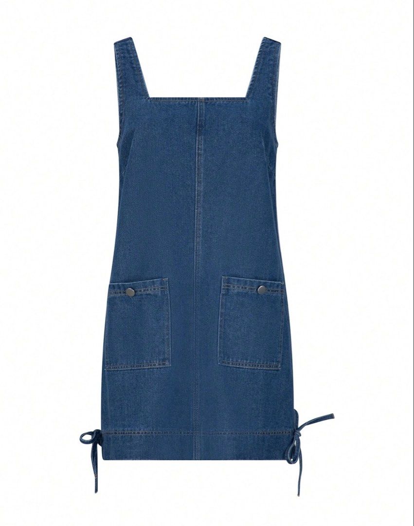 Blue Denim Dress with Pockets (Category: Dresses) located in Quezon City. Submitted by shop_mnl (Listing ID 1467974164, Image 1). Description: - Style: Denim mini dress with a straight silhouette - Neckline & Straps: Square neckline with wide straps - Details: Front utility pockets with metallic snap buttons and side hem ties - Fabric: Medium wash denim with visible contrast stitching - Versatility: Sleeveless design, easy to layer over a tee or 