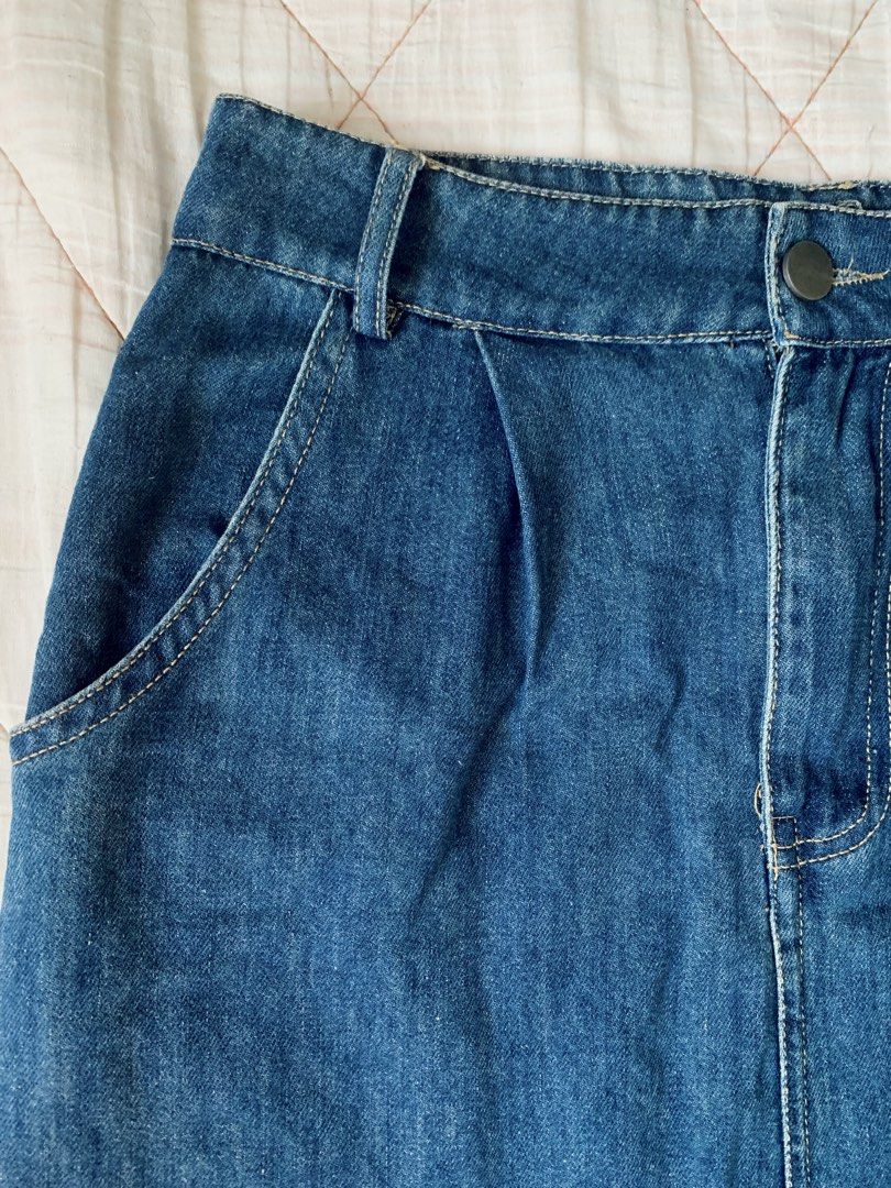 Blue Denim Midi Skirt with Back Slit (Category: Skirts) located in Bacoor. Submitted by krisery (Listing ID 1467949529, Image 2). Description: - Style: Mid-length denim skirt in a classic medium denim blue - Fit: High-waisted with front button closure and belt loops - Size: M on tag - Waist: 26 inch - Length: 30.5 inch - Fabric: Soft Denim (Lightweight/Non-stretch) - 2 Back and 2 Side Pockets - Condition: Excellent/No Damage - Not Faded color - G