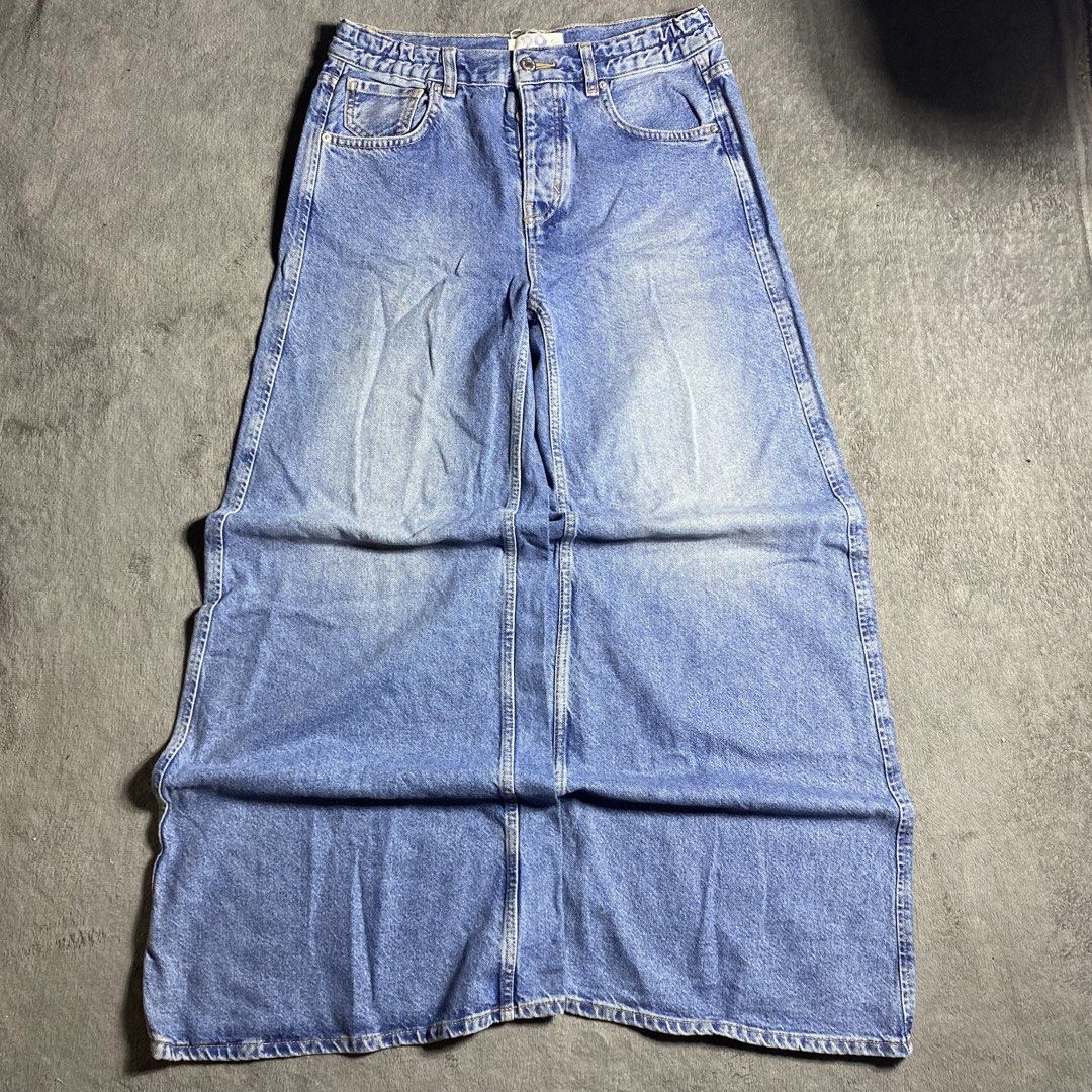 Blue Denim Wide Leg Jeans Pants (Category: Jeans) located in Manila. Submitted by thrifturfit_star (Listing ID 1467853192, Image 1). Description: - Style: Wide leg fit with a flattering high-rise waist - Wash: Medium denim wash with natural fading - Closure: Classic button and zip fly with belt loops - Pockets: Functional front and back pockets - Details: Trendy folded bottom hem - Perfect for: Casual everyday wear and stylish OOTDs.