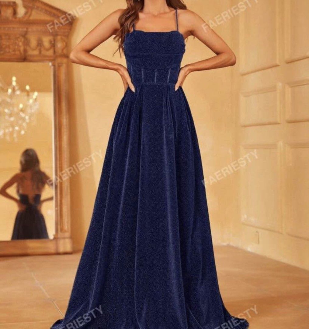 BLUE GLITTER BACKLESS CAMI PROM GOWN (Category: Evening dresses & gowns) located in Manila. Submitted by prelovedbyleii (Listing ID 1467872356, Image 1). Description: - Color: Navy blue with an all-over glittery finish - Design: Square neckline, thin straps, and fitted bodice with structured corset lines - Length: Long, floor-skimming flared skirt - Closure: Secure back zip fastening - Condition: Worn once for a dinner event, freshly dry cleaned 