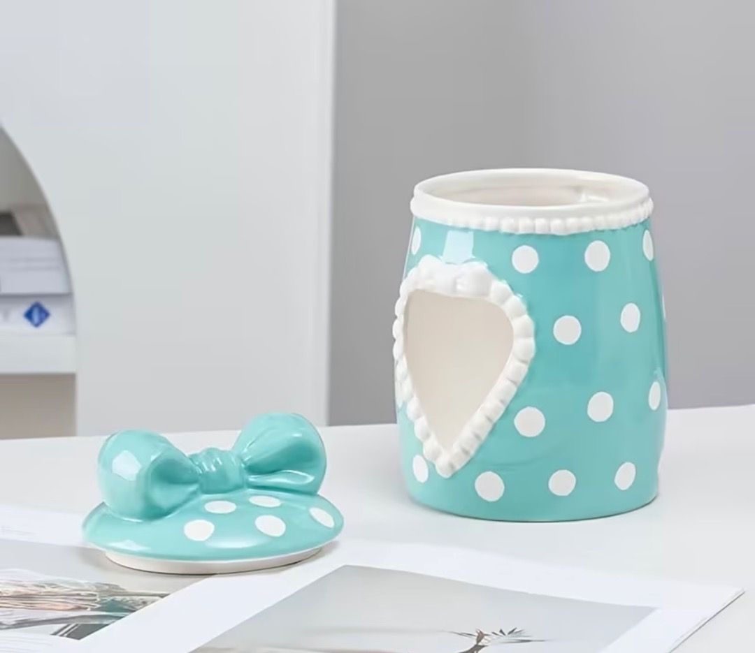 Blue Polka Dot Ceramic Tissue Box with Bow Lid (Category: Bedding & Towels) located in Subic. Submitted by anything_lovely_under_the_sun (Listing ID 1467918695, Image 2). Description: - Material: Smooth glossy ceramic - Design: Bright blue with white polka dots and a heart-shaped tissue cutout - Lid: Matching lid with a cute dimensional bow on top - Compatibility: Fits standard roll tissues or folded sheets - Use: Perfect vanity or tabletop decor