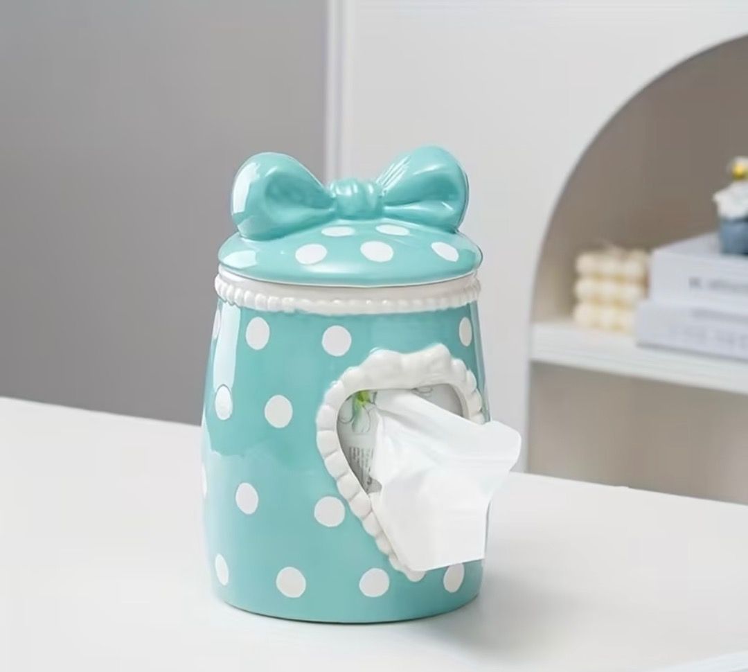 Blue Polka Dot Ceramic Tissue Box with Bow Lid (Category: Bedding & Towels) located in Subic. Submitted by anything_lovely_under_the_sun (Listing ID 1467918695, Image 3). Description: - Material: Smooth glossy ceramic - Design: Bright blue with white polka dots and a heart-shaped tissue cutout - Lid: Matching lid with a cute dimensional bow on top - Compatibility: Fits standard roll tissues or folded sheets - Use: Perfect vanity or tabletop decor