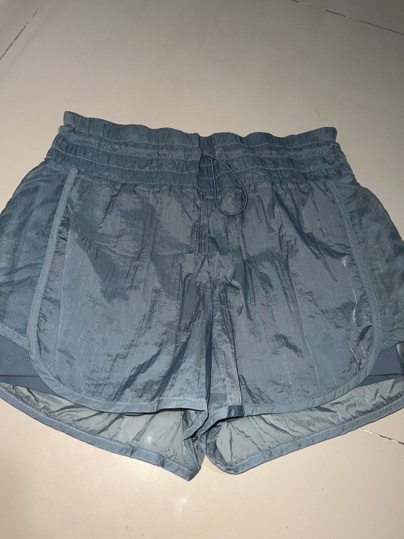 Blue Running Shorts built-in liner size M (Category: Activewear) located in Pasig City. Submitted by epitome.ph (Listing ID 1467938073, Image 1). Description: - Brand: Unknown - Size: Medium - Color: Dusty Blue - Material & Design: Crinkle texture fabric with breathable mesh side panels - Comfort & Fit: Elastic waistband with adjustable drawstring and built-in liner shorts for extra coverage - Origin: Made in Vietnam - Condition: Clean, excellent