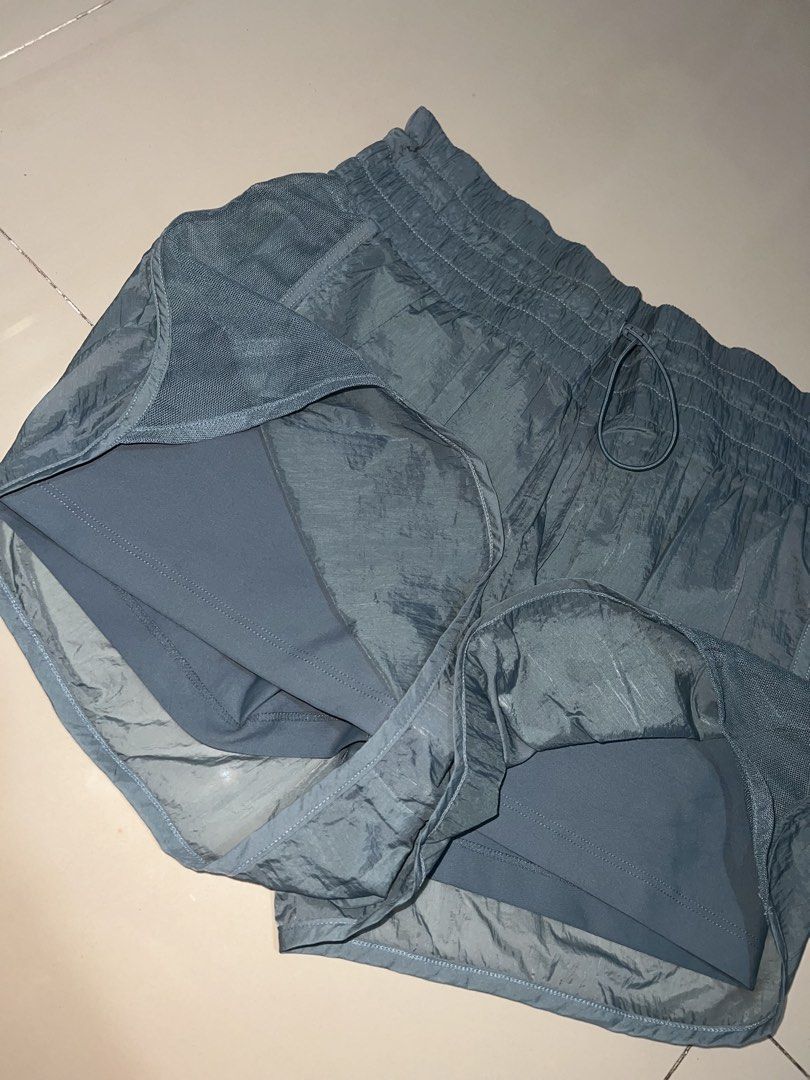 Blue Running Shorts built-in liner size M (Category: Activewear) located in Pasig City. Submitted by epitome.ph (Listing ID 1467938073, Image 3). Description: - Brand: Unknown - Size: Medium - Color: Dusty Blue - Material & Design: Crinkle texture fabric with breathable mesh side panels - Comfort & Fit: Elastic waistband with adjustable drawstring and built-in liner shorts for extra coverage - Origin: Made in Vietnam - Condition: Clean, excellent