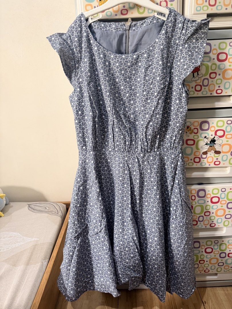 Blue White Floral Pattern Flutter Sleeve Dress With Zipper (Category: Babies & Kids Fashion) located in Baguio. Submitted by myizztuff (Listing ID 1468054342, Image 1). Description: - Style: Blue dress with a white geometric floral pattern - Design: Short flutter sleeves, round neckline, and a flattering flared skirt - Details: Smooth grey inner lining and a reliable YKK back zipper closure - Length: Approximately 86 cm - Condition: Clean fabric 