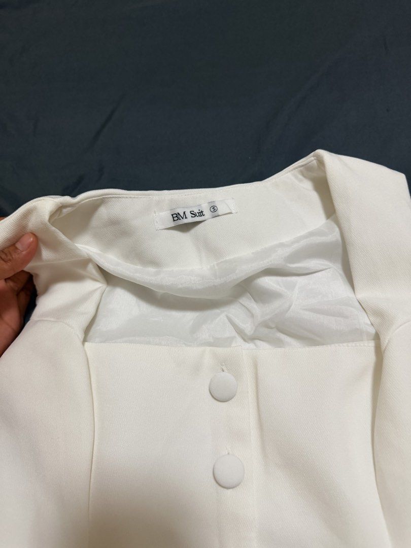BM Suit White Sleeveless Button Blazer Vest Size S (Category: Sleeveless) located in Calamba. Submitted by pchyapples (Listing ID 1467908576, Image 3). Description: - Brand: BM Suit - Size: S -32-34 bust -27-28 waist - Color: Clean White - Design: Structured neckline with 5 fabric-covered buttons and 2 faux welt pockets - Details: Fully lined interior - Style: Minimal, professional, and versatile for office or casual smart outings.