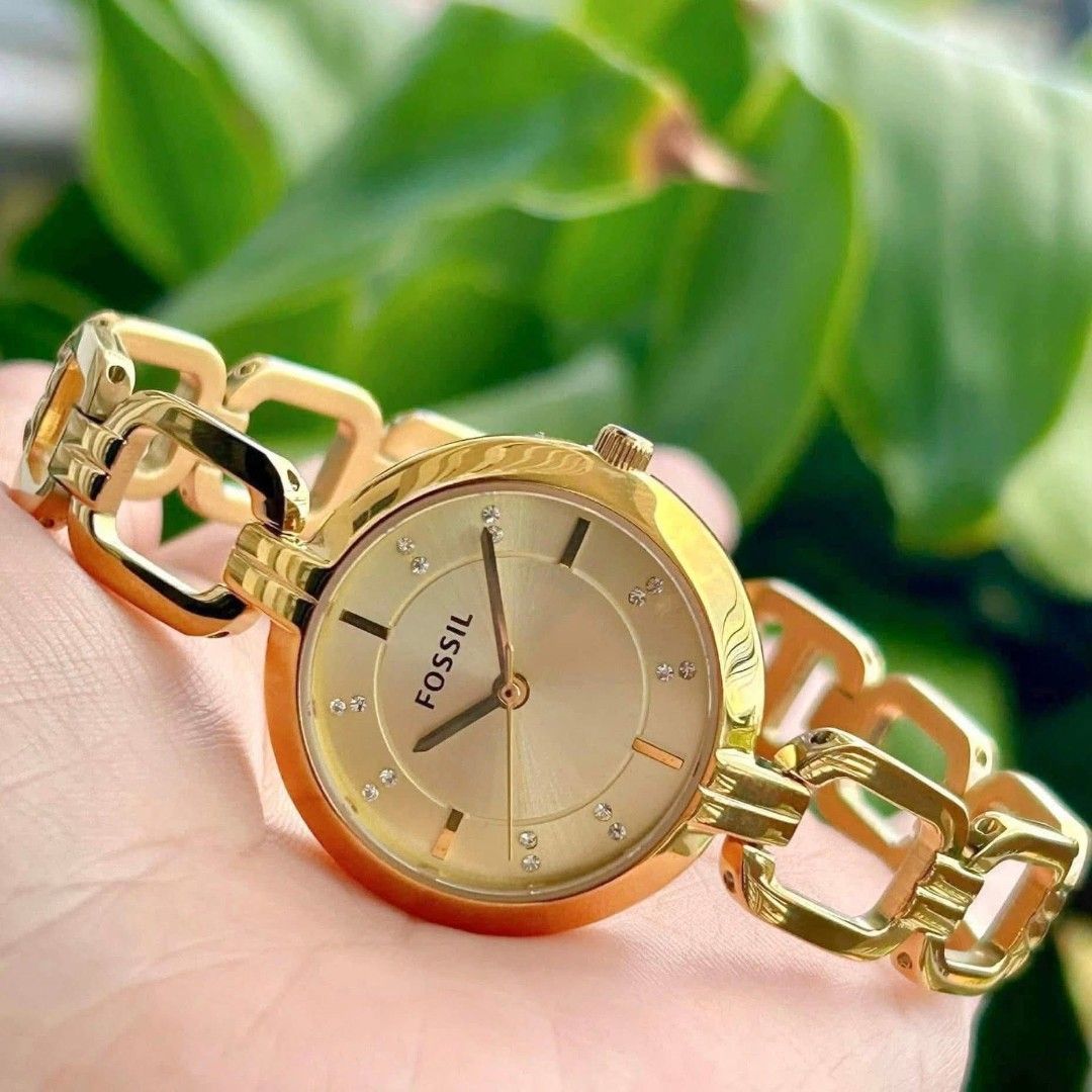 BNWT Authentic FOSSIL Kerrigan Gold Tone (Category: Women's Watches) located in Compostela. Submitted by declutteringmyclozet (Listing ID 1467878755, Image 3). Description: Authentic Fossil Kerrigan Gold Tone Stainless Steel Brand new, never worn with original store tag and plastic wrap still intact Elegant gold sunray dial with classic Roman numerals and sparkling crystal dot markers with Box and Paper Bag Sure buyers only!!.
