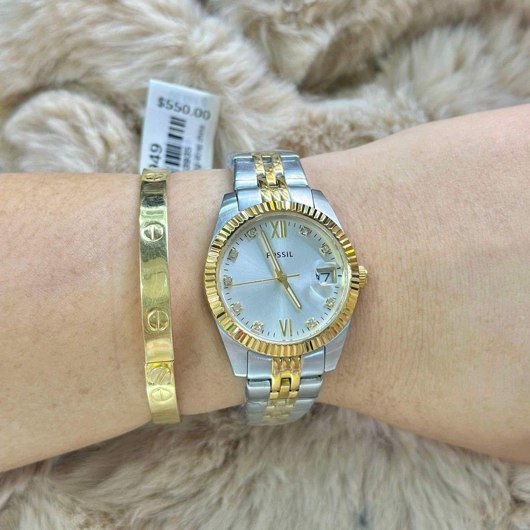 BNWT AUTHENTIC FOSSIL SCARLETTE TWO TONE (Category: Women's Watches) located in Compostela. Submitted by declutteringmyclozet (Listing ID 1467883795, Image 1). Description: Authentic Fossil Scarlette Mini Three-Hand Date Two-Tone Stainless Steel Brand new, never worn with original store tag and plastic wrap still intact Classic silver sunray dial with a luxury fluted bezel, crystal accents, and a magnified date window with Box and Paper Bag Sure 