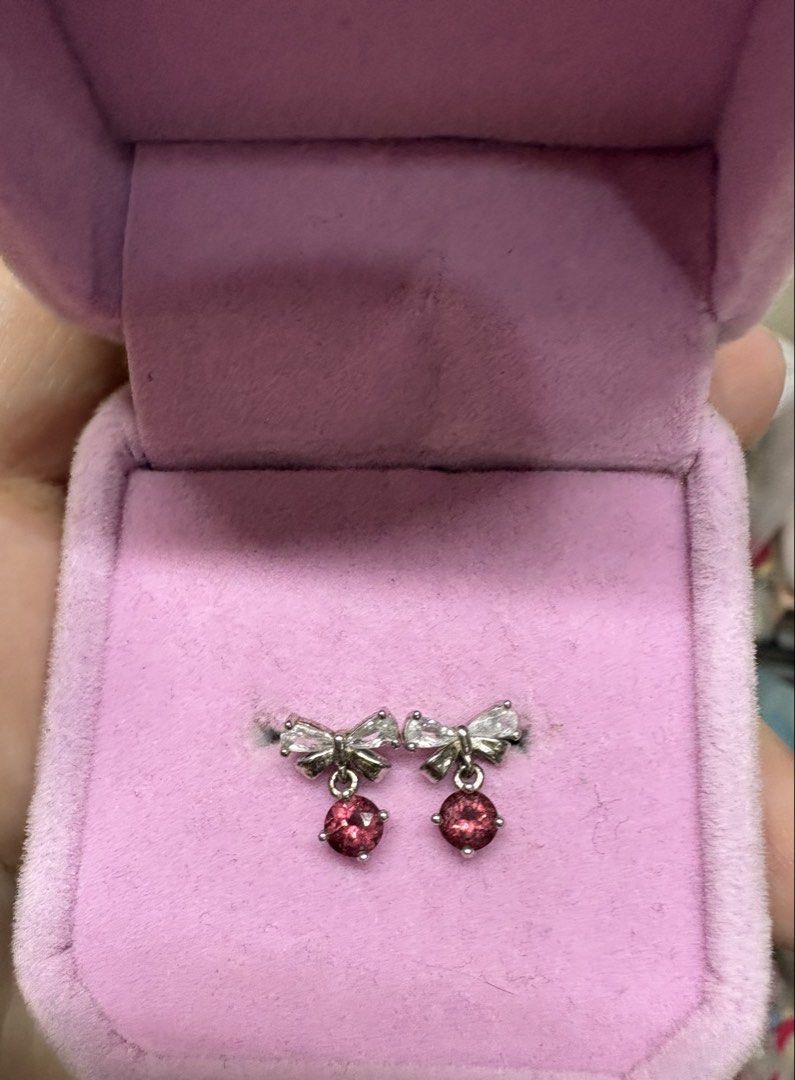 Bow Dangle Earrings with Red Garnet Stones S925 (Category: Earrings) located in Manila. Submitted by alyannaros79007 (Listing ID 1467981742, Image 1). Description: - Silver-tone S925 bow design with sparkly clear accent stones - Dangling round red garner gemstones for a sweet, feminine look - Comfortable post-back closure.