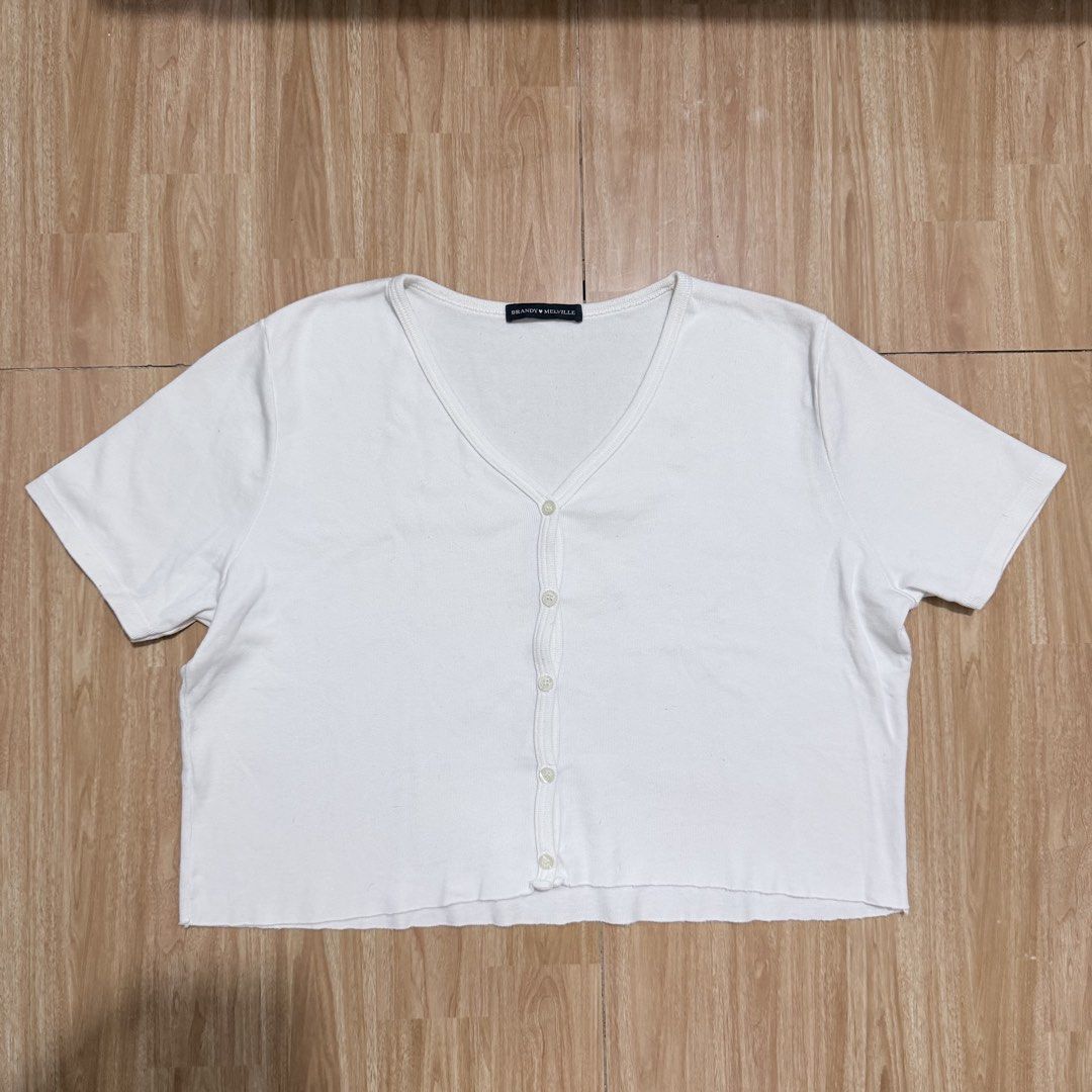 Brandy Melville White Button-Up Top (Category: Shirts) located in Angeles City. Submitted by gooddealsbytey (Listing ID 1468008762, Image 1). Description: Width: 19 | Length: 16.5.