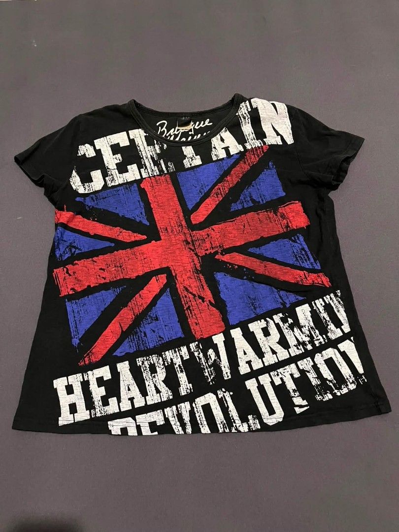 Brave Man Black Graphic Tee Union Jack Size L (Category: Tshirts & Polo Shirts ) located in Pasacao. Submitted by kakiethriftapparel01217 (Listing ID 1467971040, Image 1). Description: - Color: Black - Size: Large - Material: 100% Cotton, comfortable fit - Design: Large distressed Union Jack graphic print on the front - Details: 'CERTAIN' printed at the top, 'HEART WARM REVOLUTION' at the bottom - Branding: Brand signature printed inside the coll