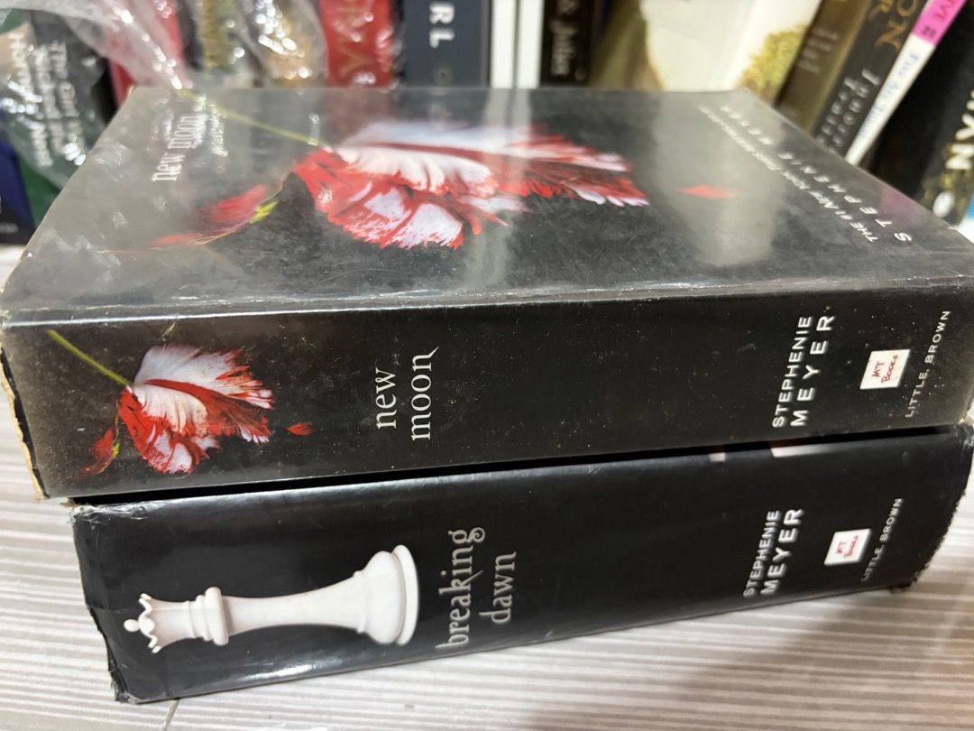 Breaking Dawn Stephenie Meyer Hardbound Book (Category: Storybooks) located in Angeles City. Submitted by yanaa0899 (Listing ID 1467867442, Image 1). Description: READ FIRST! THIS IS A PROJECT BOOK!! If you want to spray paint or revive the book condition this is perfect for you. May value padin ito kasi hardbound. Title:Breaking by Stephenie Meyer + FREE New Moon Paperback (heavy foxing) - Edition: Hardbound - Condition: Cover has minor edge wea