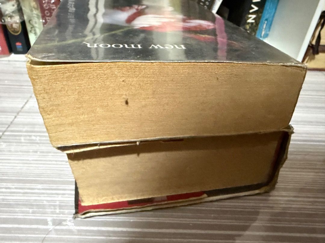 Breaking Dawn Stephenie Meyer Hardbound Book (Category: Storybooks) located in Angeles City. Submitted by yanaa0899 (Listing ID 1467867442, Image 2). Description: READ FIRST! THIS IS A PROJECT BOOK!! If you want to spray paint or revive the book condition this is perfect for you. May value padin ito kasi hardbound. Title:Breaking by Stephenie Meyer + FREE New Moon Paperback (heavy foxing) - Edition: Hardbound - Condition: Cover has minor edge wea
