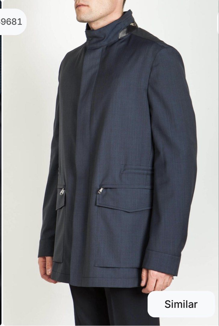 Brioni - Virgin Wool Jacket (Category: Coats, Jackets and Outerwear) located in Mandaluyong City. Submitted by fellas_ph (Listing ID 1467951796, Image 2). Description: Long virgin wool jacket with stand-up collar, hidden hood, four front pockets, invisible zip and button fastening, snap cuffs, internal drawstring waist and one internal zip pocket. Excellent condition No issues Size XL 2,698 Euro Sold Price (189k+ php) 24" Width 32.5" Length 19.5"
