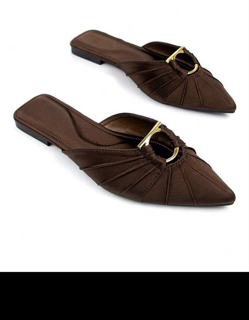 Brown Satin Pointed Toe Flat Mules with Gold Hardware (Category: Flats & Sandals) located in Taguig. Submitted by restyle.mn (Listing ID 1467850010, Image 1). Description: - Rich brown satin finish with elegant pointed toe - Unique pleated fabric design with a stylish gold-tone metal ring detail - Easy slide-on flat sole for all-day comfort - Dark brown inner lining Size 7.