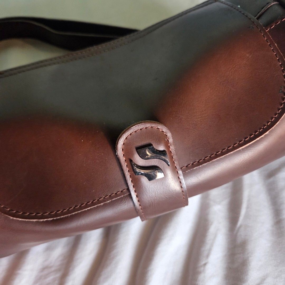 Brown Shoulder Bag (Category: Shoulder Bags) located in Quezon City. Submitted by anirbash (Listing ID 1467926777, Image 2). Description: Brown Shoulder bag for women. - Tube round type design - Items inside + phone outside in pictures for size guide - Can fit a lot of stuff in it actually like a digicam (Kodak Pixpro wpz2), cellphone, bath and body works candle large, rubbing alcohol - Shipping is shouldered by buyer - Location: Tomas Morato, QC