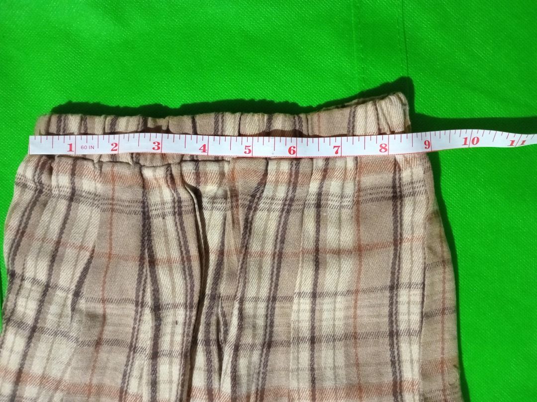 Brown Top and Plaid Skirt Set (Category: Babies & Kids Fashion) located in Quezon City. Submitted by macon0948 (Listing ID 1467893561, Image 3). Description: - Matching Set: Brown long-sleeve top and pleated plaid skirt - Top Details: Side button closure and three decorative front bows - Skirt Details: Brown, beige, and cream plaid pattern with a comfy elastic waistband - Material: Soft and cozy knit fabric - Condition: Brand new with red tag att