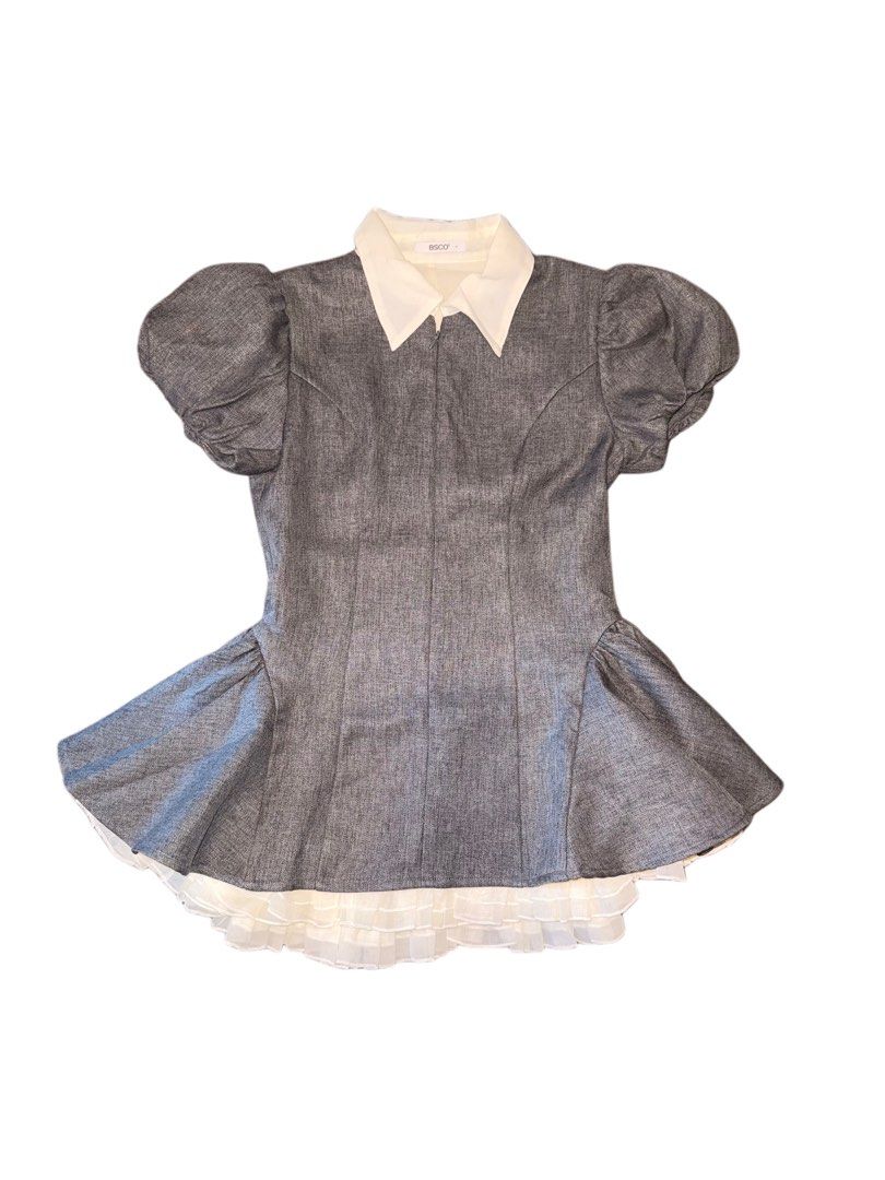 BSCO Grey Denim Puff Sleeve Collared Dress (Category: Dresses) located in Manila. Submitted by ilove.sushi (Listing ID 1467919189, Image 1). Description: - Brand: BSCO - Style: Grey denim mini dress with structured bodice and flare skirt - Details: Contrasting white pointed collar and trendy puff sleeves - Hem: Layered white ruffled hem underneath - Closure: Front zipper - Material: Comfortable cotton blend.