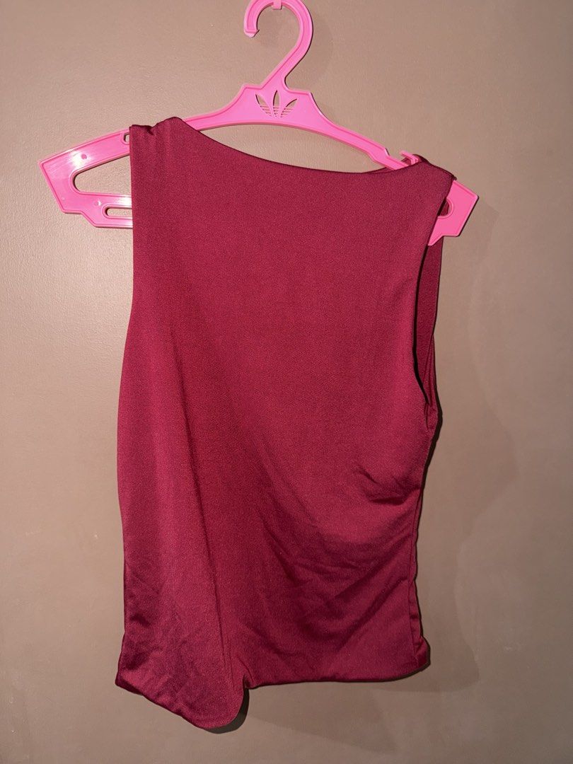 BSCO Maroon Sleeveless Top Size M (Category: Sleeveless) located in Davao. Submitted by fabdeclutter (Listing ID 1468054401, Image 1). Description: - Brand: BSCO - Color: Maroon - Size: Medium (tag attached) - Style: Sleeveless with a round neckline - Material: Lightweight and stretchy fabric - Condition: Great, worn a few times, clean and ready to wear - Versatile: Easy to match with jeans or skirts.