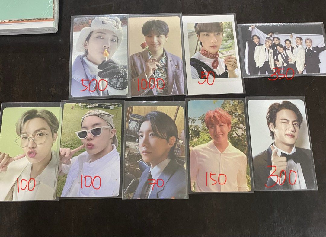 BTS Official Photocards RM Jin Suga J-Hope (Category: K-Wave Merchandise) located in Balanga. Submitted by thvbear (Listing ID 1467969922, Image 1). Description: - Official BTS photocards available individually - Condition: All kept in protective sleeves - RM (Winter Hat): ₱500 - Suga (Holding Rose): ₱1000 - Jin (Polaroid Style): ₱50 - Jin (Tuxedo Pointing Finger): ₱300 - Group Photo: ₱350 - J-Hope (Glasses & Green Background): ₱100 each - J-Hope