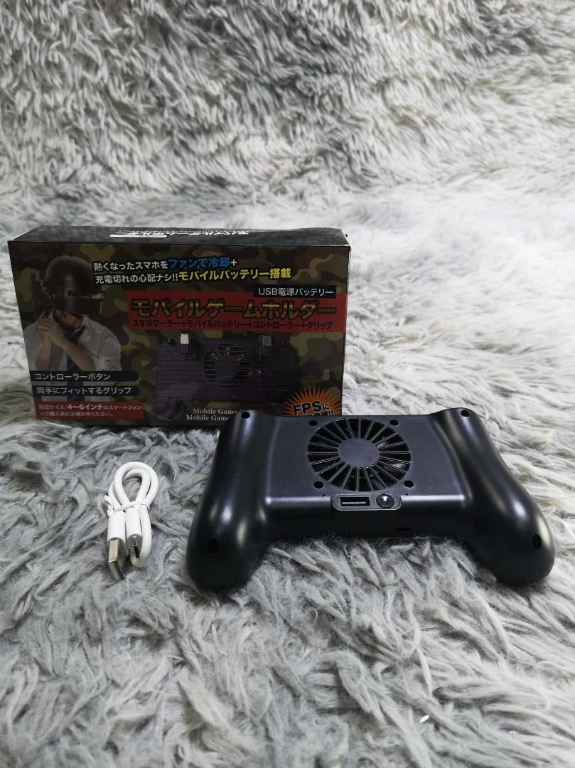 Built In Fan Smartphone Mobile Game Controller (Category: Other Mobile & Gadget Accessories) located in Santa Cruz. Submitted by jmy_surplus.2 (Listing ID 1467974760, Image 1). Description: Size ; L- 4.2 W - 6.6 Color ; Black Type ; Mobile Game Controller Brand ; No Brand Material ; Plastic Style ; Black Mobile Game Controller For Smartphone LG 118 JMY 3 Batch #225.