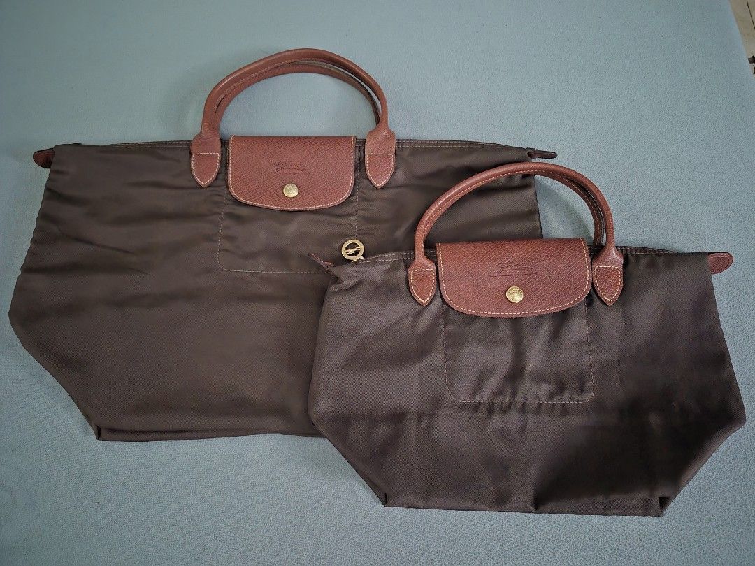 [Bundle] Longchamp Le Pliage Brown Tote Bag Set (2 Sizes) (Category: Tote Bags) located in Quezon City. Submitted by gbabesy2.0 (Listing ID 1467869163, Image 1). Description: - Set of 2 Longchamp Le Pliage short handle bags in classic olive green - Includes one large travel-size tote and one smaller handbag - Durable nylon body with iconic brown leather handles and flap closure - Secure zip top with snap button fastening - Convenient foldable des