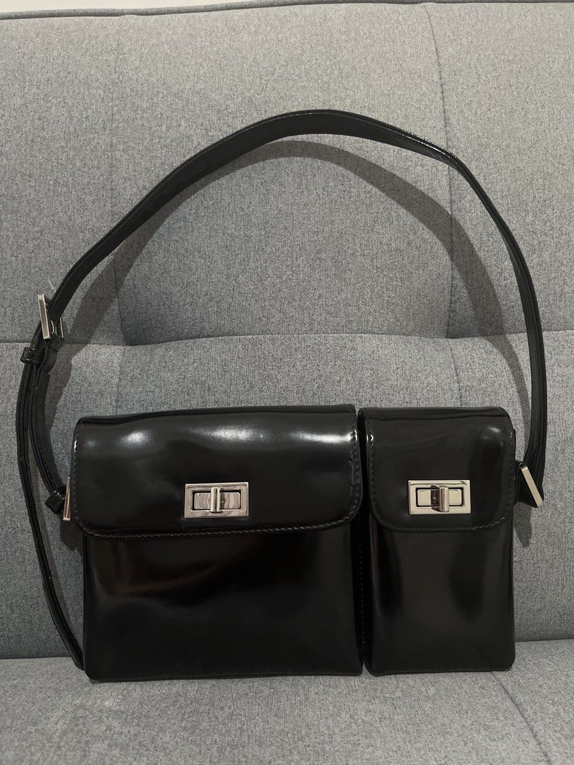 By Far Black Patent Leather Shoulder Bag (Category: Luxury Bags & Wallets) located in Las Pinas. Submitted by erenrosc (Listing ID 1467914848, Image 1). Description: By Far shoulder bag in black patent leather. Silver twist-lock closures on the front flaps. Includes two exterior front compartments. Adjustable shoulder strap. Neutral lining inside with embossed brand patch. Minor scuffs on the hardware from normal use. End of strap has minor flaws