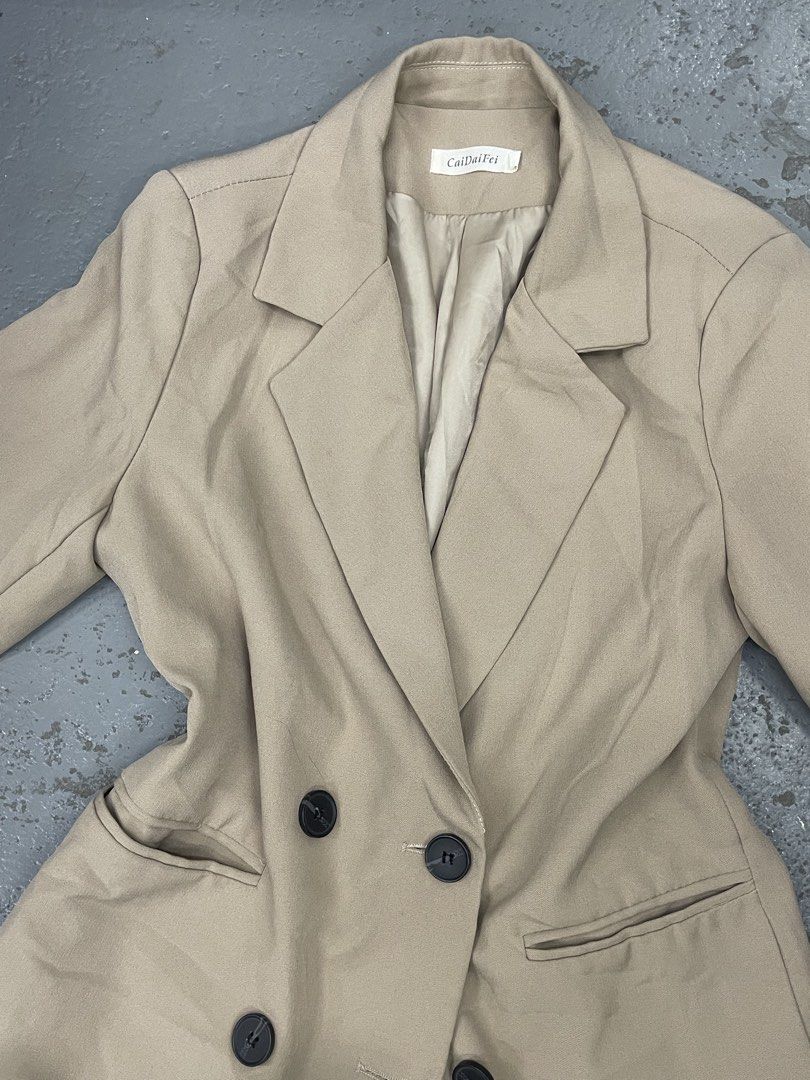 CaiDaiFei Beige Double Breasted Blazer Jacket Plaid Cuffs (Category: Coats, Jackets and Outerwear) located in Bulacan. Submitted by grazcloset (Listing ID 1467890634, Image 2). Description: - Brand: CaiDaiFei - Color: Beige with black buttons - Style: Double-breasted blazer M-L.