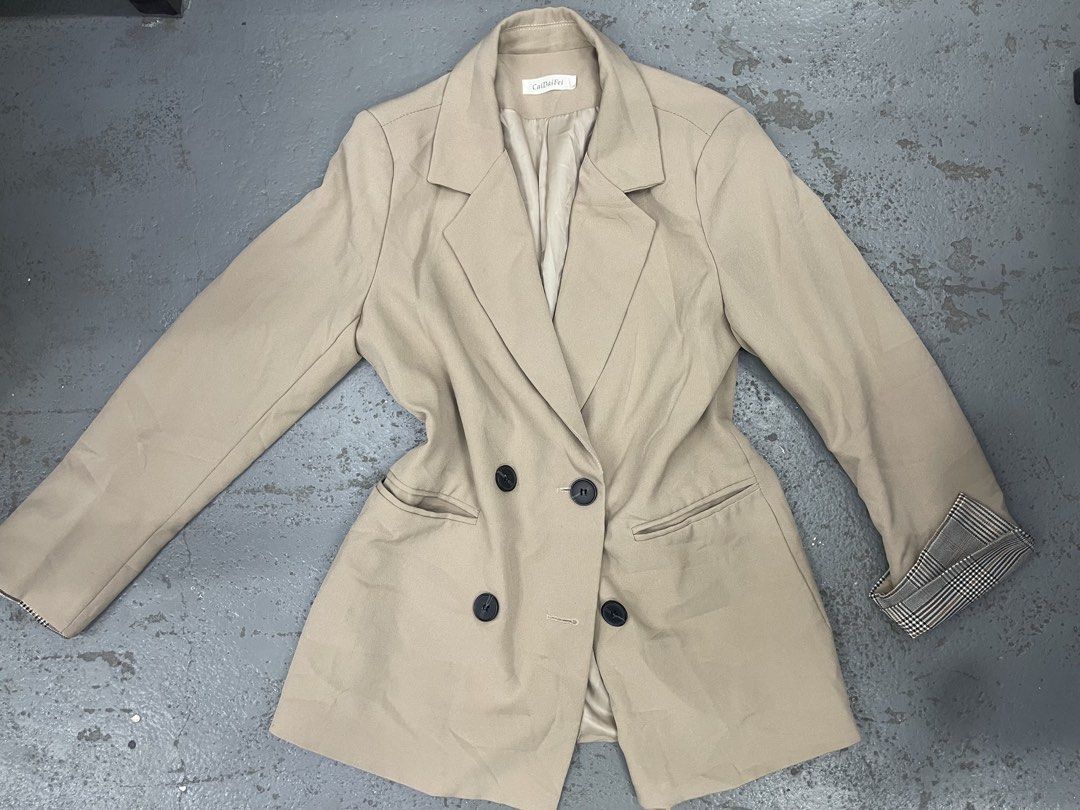 CaiDaiFei Beige Double Breasted Blazer Jacket Plaid Cuffs (Category: Coats, Jackets and Outerwear) located in Bulacan. Submitted by grazcloset (Listing ID 1467890634, Image 1). Description: - Brand: CaiDaiFei - Color: Beige with black buttons - Style: Double-breasted blazer M-L.