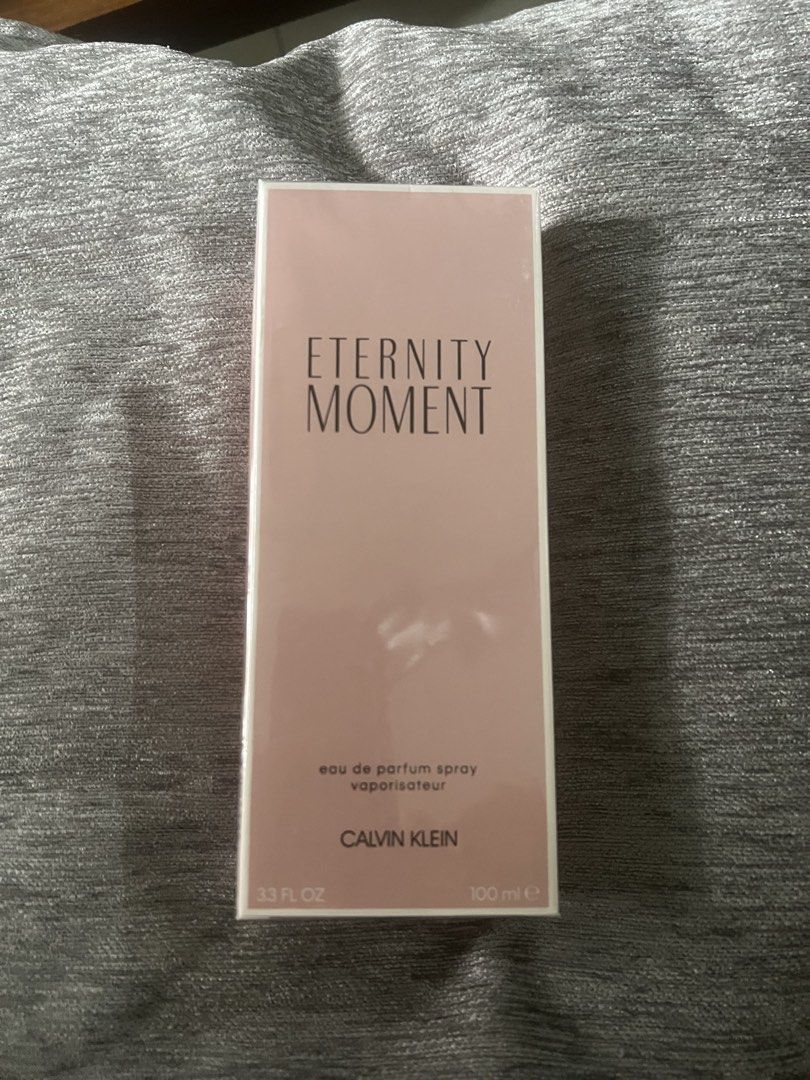 Calvin Klein Eternity Moment Eau de Parfum 100ml (Category: Fragrance & Deodorants) located in Manila. Submitted by kcirtapoabmir (Listing ID 1467897474, Image 1). Description: - Brand: Calvin Klein - Fragrance: Eternity Moment Eau de Parfum (EDP) - Size: 100 ml / Full size spray bottle - Condition: Brand new, unopened, and still sealed in original plastic wrap - Packaging: Pink box - Perfect for daily wear or as a gift.
