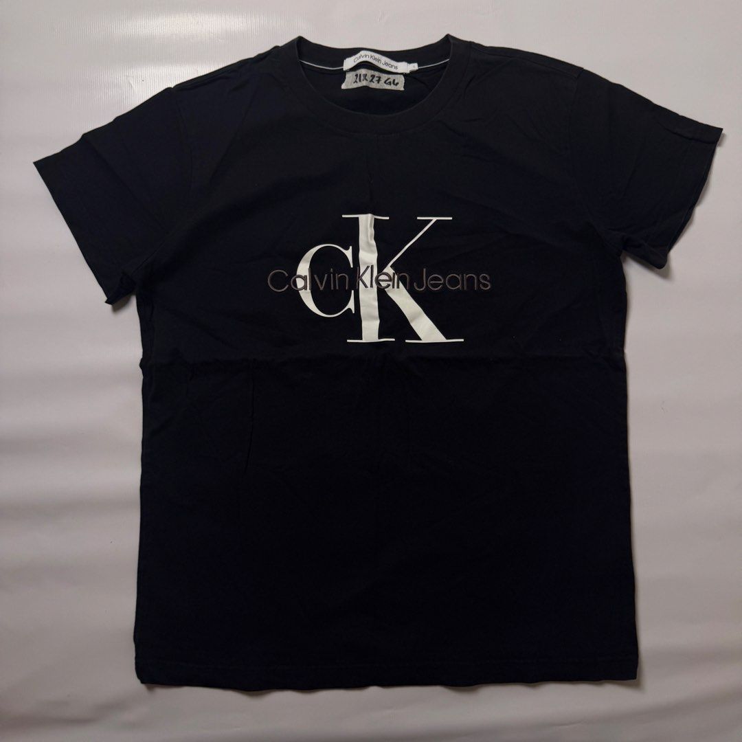 Calvin Klein Jeans Black Monogram Tee Size L (Category: Tshirts & Polo Shirts ) located in Gapan. Submitted by rasthriftshop17 (Listing ID 1467996043, Image 1). Description: Size on tag: L Dimes: 21 x 27 Condition: Excellent Color rate: 9/10 Issue: None.