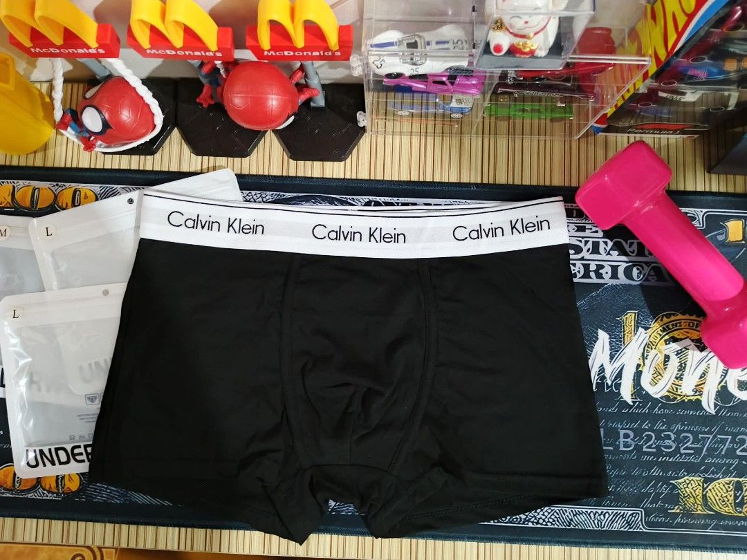Calvin Klein Men's Boxer Briefs Bundle (Category: Underwear) located in Taytay. Submitted by roseannblente2016 (Listing ID 1467906835, Image 1). Description: - Authentic Calvin Klein boxer - Classic colors: Black, White, and Grey - Premium cotton - Iconic branded elastic waistband on each pair - Clean stitching and soft fabric texture - Includes 3 individual frosted zip-lock packaging bags - Available in sizes M and L - Grab the set today!.