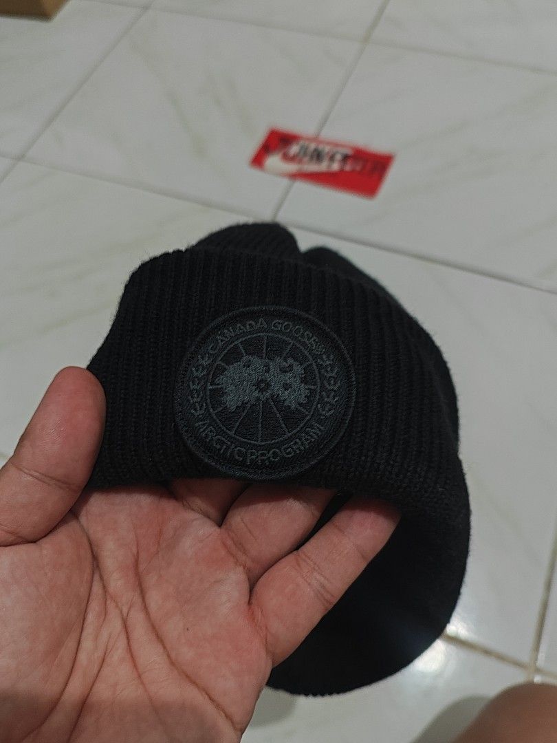 Canada Goose Black Ribbed Beanie Hat (Category: Caps & Hats) located in Tuguegarao City. Submitted by johnpetera0818 (Listing ID 1468024660, Image 2). Description: - Brand: Canada Goose - Style: Ribbed knit beanie with foldover cuff - Color: Classic black with tonal black arctic program logo patch - Material: 100% Merino wool for ultimate warmth and comfort - Size: O/S (One Size) - Condition: Clean, brand new with tags intact.