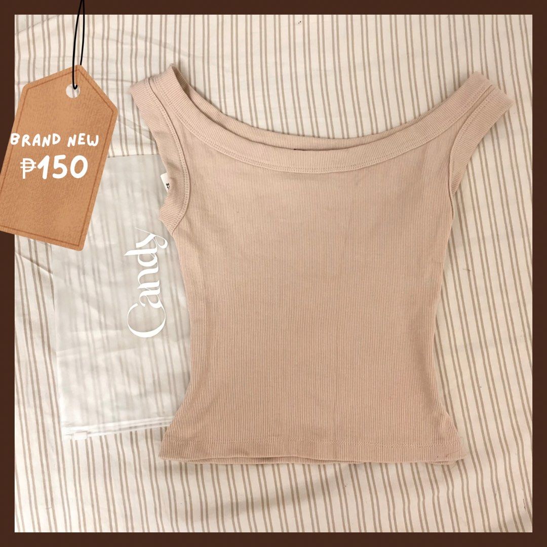 Candy Off Shoulder Ribbed Top Porcelain XS (Category: Sleeveless) located in Manila. Submitted by gentle_snowy (Listing ID 1467971123, Image 1). Description: - Brand: Candy - Style: Off-shoulder ribbed top - Color: Porcelain - Size: Extra Small (XS) - Condition: Brand new with tags, never worn - Features: Super stretchy, flattering fit, great basic for jeans or skirts - Packaging: Includes original ziplock packaging - Original Price: ₱279.