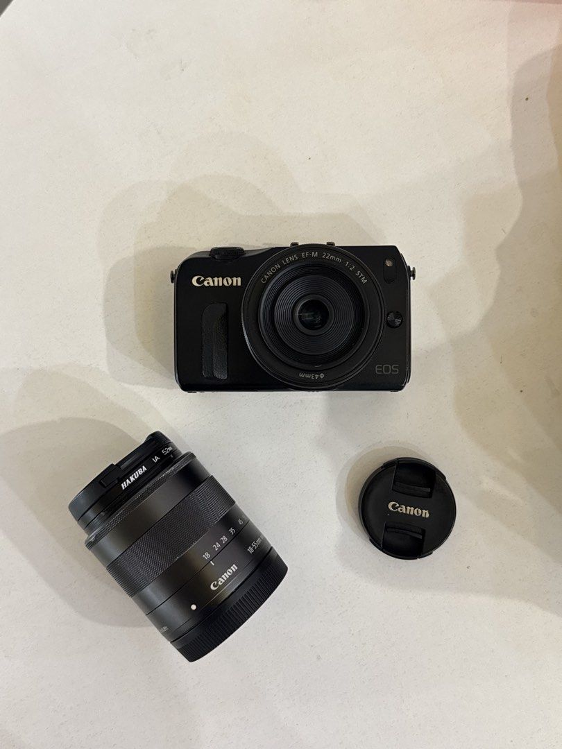 Canon EOS M Mirrorless Camera with Dual Lens Kit (Category: Cameras) located in Taguig. Submitted by kgilliann (Listing ID 1447891705, Image 2). Description: Canon EOS M Mirrorless Camera - 18 MP APS-C sensor - Canon EF-M lens mount - 3.0-inch touchscreen LCD - 8/10 body cosmetics - Fully functional Inclusions: - 22 mm lens (kit lens) and 18-55 mm lens - 4 GB memory card - Screen protector (although may scratches na rin 'yung protector) - Origina
