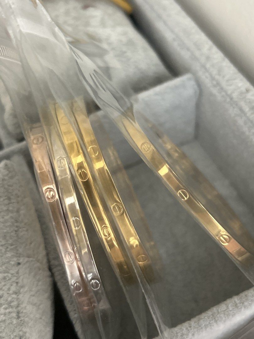 Car-Car Bangle Stainless Steel (Category: Bracelets) located in Manila. Submitted by elonlineshop (Listing ID 1467862518, Image 1). Description: - Cartier Love bracelets - Finishes include rose gold, silver, and yellow gold - Classic screw motifs engraved all around the bands - Brand new in original protective plastic sleeves - Versatile styling: stack them together or wear them separately.