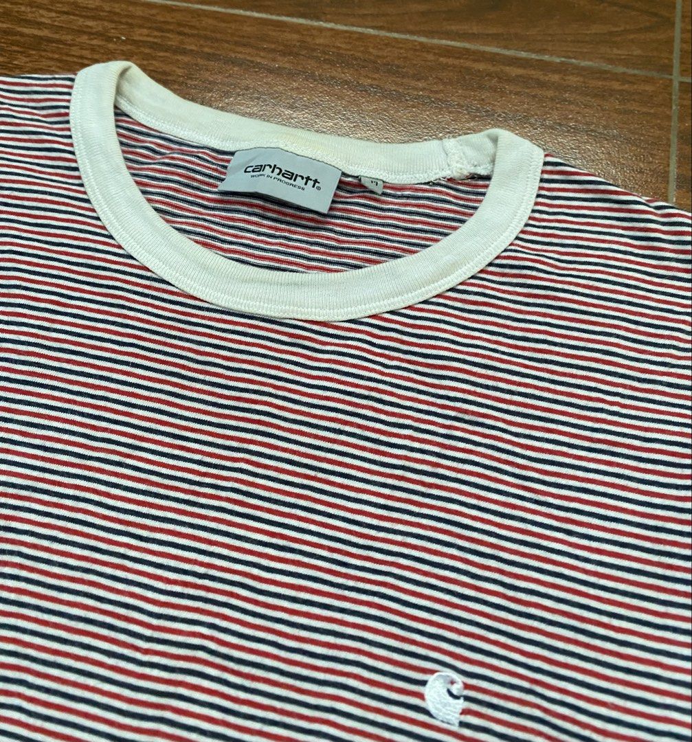 CARHARTT (Category: Tshirts & Polo Shirts ) located in Cebu City. Submitted by thriftpherskzai (Listing ID 1467975098, Image 3). Description: - Brand: Carhartt WIP (Model: S/S Gordon Striped T-Shirt) - Size: Medium - Colorway: Red, white, and navy horizontal stripes with a white crewneck - Details: Iconic small embroidered Carhartt WIP logo on the chest - Material: 100% breathable cotton, made in Bulgaria - Condition: Excellent everyday casual we