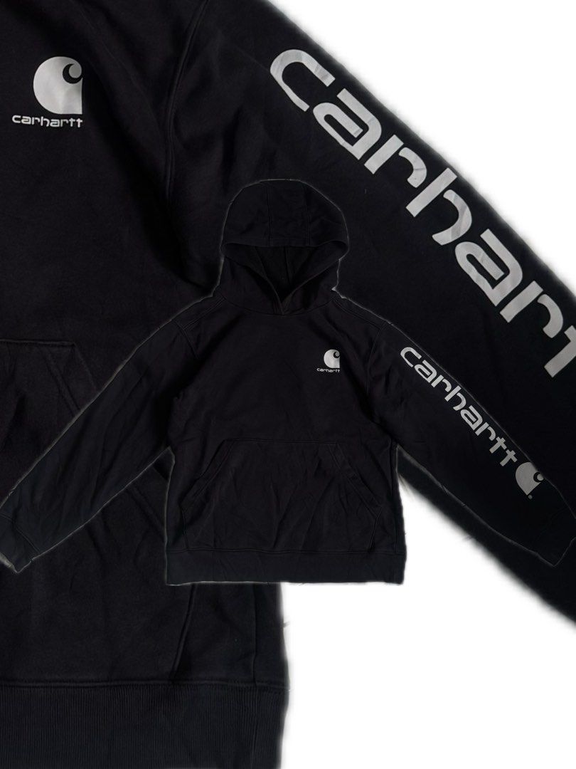 Carhartt Logo Hoodie (Category: Coats, Jackets and Outerwear) located in Teresa. Submitted by boanerjes (Listing ID 1467879415, Image 1). Description: This Carhartt Logo Hoodie is perfect for kids and youth who love a comfortable and stylish hooded sweatshirt. It comes in size Large (14-16) and black color, with the iconic Carhartt logo on the front. The pullover style and hooded design make it a versatile piece for any occasion. Negotiable pm fo