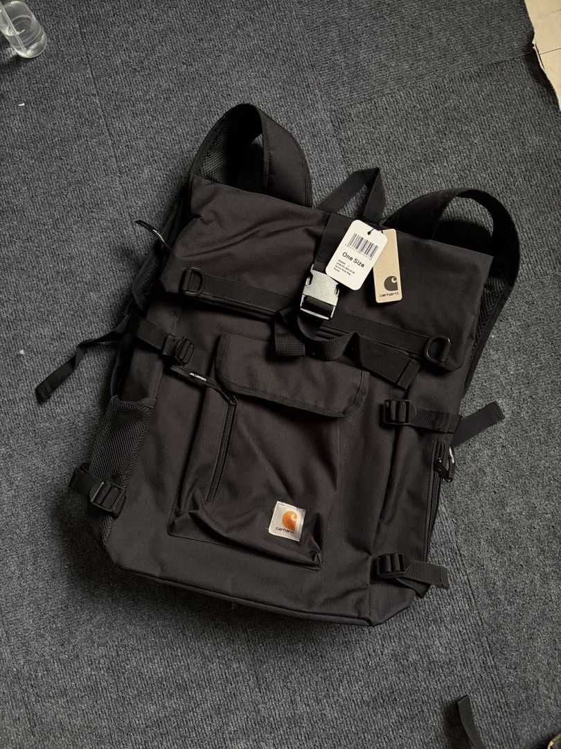 Carhartt WIP Philis Backpack Black (Category: Backpacks) located in Manila. Submitted by toys_hats005 (Listing ID 1467961032, Image 1). Description: - Brand: Carhartt WIP - Color: Black - Condition: Brand new with original tags attached - Storage: Spacious main compartment with zipper closure - Pockets: Multiple front pockets (velcro and zip) plus side mesh pocket - Comfort: Padded shoulder straps and breathable mesh back panel - Material: Durabl