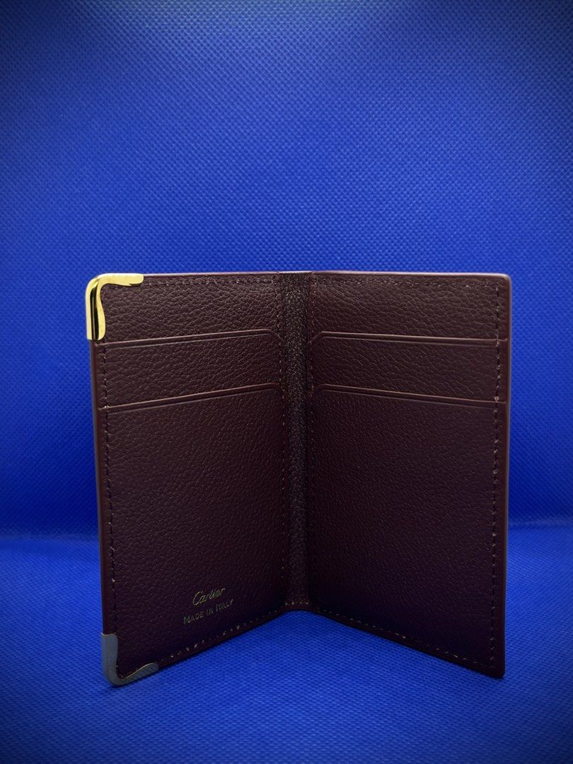 CARTIER MUST DE BI FOLD CARDHOLDER (Category: Wallets & Card Holders) located in Mandaluyong City. Submitted by sayso_says (Listing ID 1467994741, Image 3). Description: Cartier Must De Bi-fold Card Holder 🍷 Color: Wine Red / Burgundy 👜 Material: Calfskin Leather ✨ Condition: Excellent condition 📦 Inclusions: Cartier box, inner packaging, dust bag, booklet 🇸🇦 Purchased from: Saudi Arabia Cartier cardholder in a deep wine red/burgundy shade w