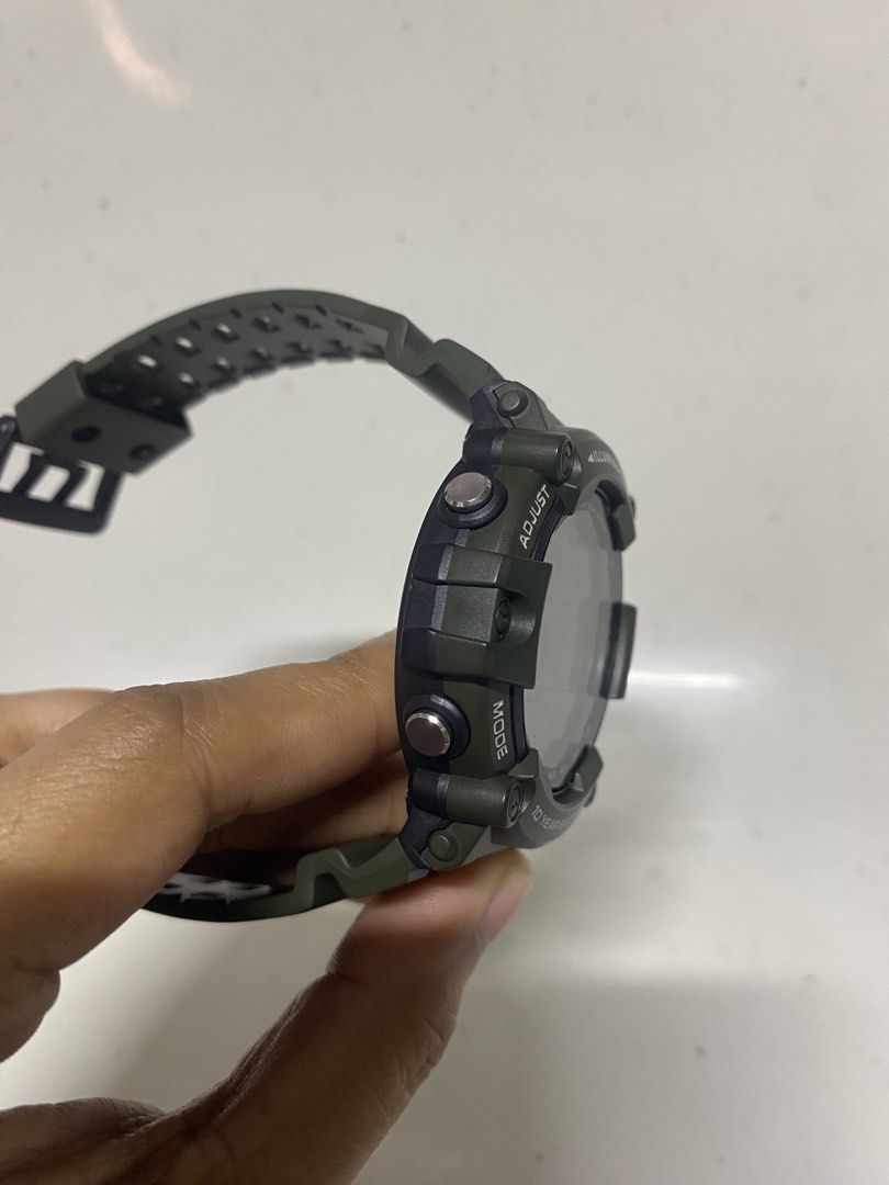 Casio AE-1500WH Digital Watch (Category: Women's Watches) located in Pasacao. Submitted by wengpullar37205 (Listing ID 1467890997, Image 3). Description: Casio AE-1500WH digital watch in olive green. Large round digital display with clear digits, day, and date. Resin strap, stainless steel back. Water resistant up to 100 meters. Built with a 10-year battery life, five alarms, and illuminator backlight. Buttons on both sides for adjusting time, li