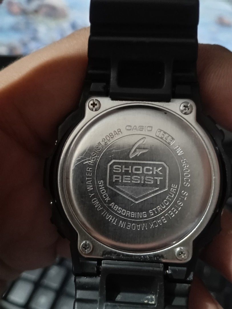 Casio G-Shock DW-5600CS Digital Watch (Category: Men's Watches) located in Manila. Submitted by jcaseanti (Listing ID 1468006787, Image 2). Description: - Model: Casio G-Shock DW-5600CS square digital watch - Color: Black resin bezel and strap with vibrant orange dial frame - Condition: Fully working electronic display showing time and date; noticeable cracks on the resin bezel near the side pushers - Features: 20bar water resistance and stainles